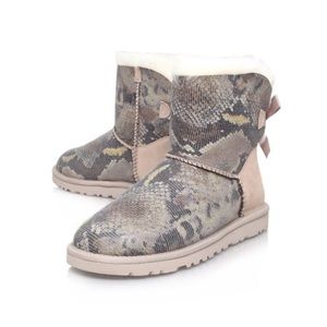 Used Bailey button bow UGGs snake pattern